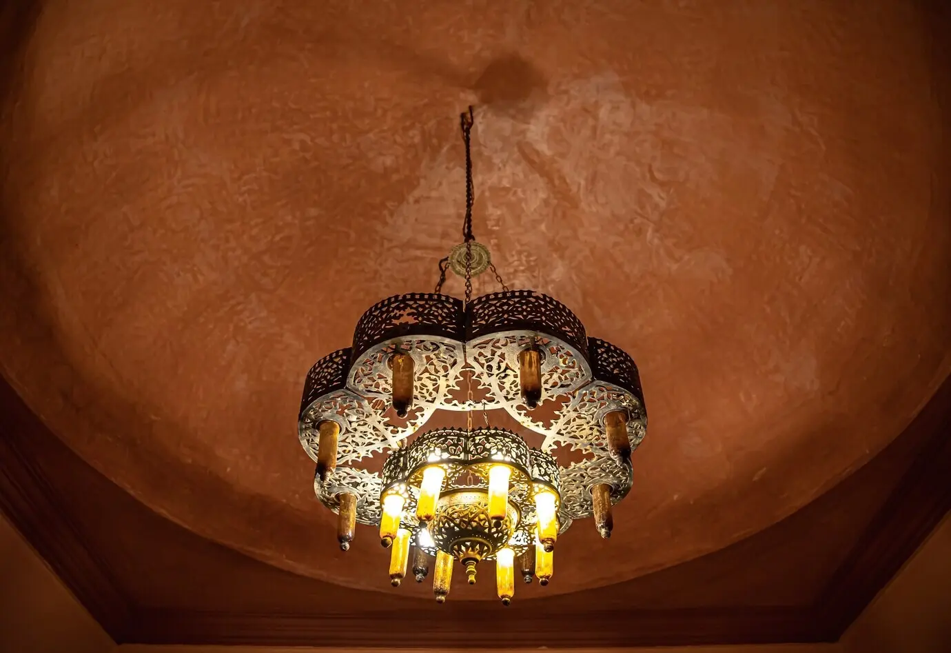 A close-up view of a ceiling chandelier in a traditional oriental style, highly detailed.