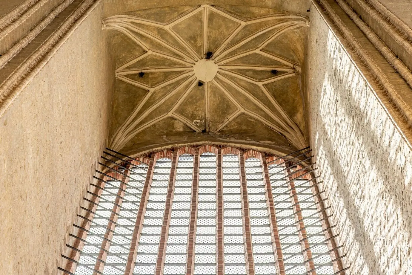 Historic stone architecture with ancient vaults and cathedral windows, evoking a sacred church atmosphere.